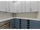 Butler's pantry with custom cabinets, a wine cooler, and plenty of storage space at 10819 Savona Way, Orlando, FL 32827