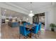 Open concept floorplan with gourmet kitchen, dining area, and access to the outdoor patio at 10819 Savona Way, Orlando, FL 32827