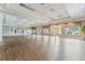 The community's large event space features wood floors and beautiful windows with neutral decor at 10819 Savona Way, Orlando, FL 32827