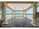 Gazebo with stone columns, a brick floor, a bench, and a scenic lake view provides a relaxing spot at 10819 Savona Way, Orlando, FL 32827