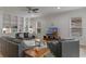 Inviting living room with built-in shelving, neutral tones, and plush seating at 10819 Savona Way, Orlando, FL 32827