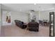Open-concept living room with comfortable seating, a ceiling fan, and a view of the TV at 10819 Savona Way, Orlando, FL 32827