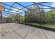 Expansive screened-in lanai offers an outdoor living space to enjoy the surrounding landscape at 10819 Savona Way, Orlando, FL 32827