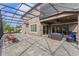 Large screened-in patio with ample seating provides an outdoor living space and relaxation at 10819 Savona Way, Orlando, FL 32827