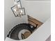 Elegant winding staircase featuring black iron railings and a modern chandelier at 10819 Savona Way, Orlando, FL 32827