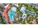 Aerial view showcasing the resort-style pools with a lazy river, and ample lounge areas at 1115 Oak Bluff Dr, Davenport, FL 33837