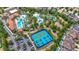 Aerial view of the community pool, lazy river, and other recreational amenities at 1115 Oak Bluff Dr, Davenport, FL 33837