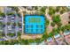 Aerial view highlighting the community's recreational facilities, including tennis and pickle ball courts at 1115 Oak Bluff Dr, Davenport, FL 33837