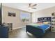 Bedroom with hardwood floors, ceiling fan, and custom bed with built in storage at 1115 Oak Bluff Dr, Davenport, FL 33837
