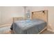 Well-lit bedroom with a modern headboard and neutral décor at 1115 Oak Bluff Dr, Davenport, FL 33837