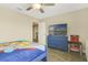 Bedroom with a large bed, a view to the ensuite bathroom, and a TV at 1115 Oak Bluff Dr, Davenport, FL 33837