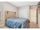 Comfortable bedroom with closet access, and carpeted floors at 1115 Oak Bluff Dr, Davenport, FL 33837