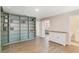 Bonus room with a custom bookcase and hardwood floors featuring a view to another bedroom at 1115 Oak Bluff Dr, Davenport, FL 33837