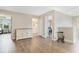 Bonus room with wood flooring, console cabinet, and access to the bathroom and bedroom at 1115 Oak Bluff Dr, Davenport, FL 33837
