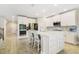 Modern kitchen with stainless steel appliances and large center island with bar seating at 1115 Oak Bluff Dr, Davenport, FL 33837