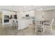Gourmet kitchen features stainless steel appliances, granite counters, and large center island at 1115 Oak Bluff Dr, Davenport, FL 33837