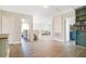Open-concept living room features hardwood floors, neutral paint and lots of natural light at 1115 Oak Bluff Dr, Davenport, FL 33837