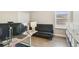 Office room with a futon, modern desk, and bright window light at 1115 Oak Bluff Dr, Davenport, FL 33837