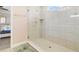 Walk-in shower features glass enclosure, tile walls, and modern fixtures at 1115 Oak Bluff Dr, Davenport, FL 33837