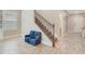Entryway view of the staircase, showing natural light, and a coat closet at 1115 Oak Bluff Dr, Davenport, FL 33837