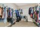 Spacious walk-in closet with ample hanging space and wood-look floors at 1115 Oak Bluff Dr, Davenport, FL 33837