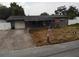 Exterior view of a single story home with front porch and driveway at 1206 Olen Dr, Daytona Beach, FL 32117