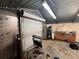 Inside garage featuring a roll up door and peg board at 1206 Olen Dr, Daytona Beach, FL 32117
