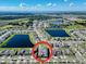 Community aerial view featuring homes, water features, and green spaces at 1210 Lone Palm Way, St Cloud, FL 34771