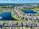 Stunning aerial view of a Primary-planned community with picturesque lakes and beautifully landscaped homes at 1210 Lone Palm Way, St Cloud, FL 34771