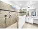 Modern bathroom with tiled shower and a well-lit vanity area at 1210 Lone Palm Way, St Cloud, FL 34771