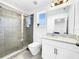 Modern bathroom with glass shower and vanity with bright natural light at 1210 Lone Palm Way, St Cloud, FL 34771