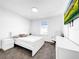 Bright bedroom with white walls, carpet floor, and flat screen TV, creating a relaxing space at 1210 Lone Palm Way, St Cloud, FL 34771