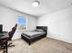 Bedroom featuring a window and modern furniture, perfect for a cozy and functional space at 1210 Lone Palm Way, St Cloud, FL 34771
