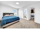 Bright bedroom with a comfortable bed and a walk-in closet at 1210 Lone Palm Way, St Cloud, FL 34771