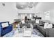 Open-concept living room with high ceilings and a view of the kitchen at 1210 Lone Palm Way, St Cloud, FL 34771