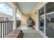 A shaded balcony with an egg chair, outdoor rug and a lounge chair at 1255 Marley Ln, Winter Springs, FL 32708
