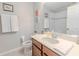 A well-lit bathroom features a single sink, white countertop, and a framed mirror at 1255 Marley Ln, Winter Springs, FL 32708