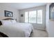 Comfortable bedroom with carpet flooring and large window providing plenty of natural light at 1255 Marley Ln, Winter Springs, FL 32708