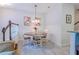 Charming dining area with a modern chandelier and seating for four at 1255 Marley Ln, Winter Springs, FL 32708