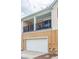 Home's two-car garage and balcony, complete with outdoor seating at 1255 Marley Ln, Winter Springs, FL 32708