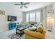 Cozy living room featuring a sofa, stylish furnishings, and a large window at 1255 Marley Ln, Winter Springs, FL 32708