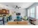 Open-concept living room with bar seating, modern decor, and abundant natural light at 1255 Marley Ln, Winter Springs, FL 32708