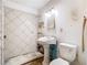 Bathroom needing renovation with damaged tiles and pedestal sink at 1263 Dunbar St, Altamonte Springs, FL 32701
