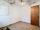 An empty bedroom requiring renovation with ceiling fan and damaged walls at 1263 Dunbar St, Altamonte Springs, FL 32701