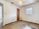 Empty bedroom requiring renovation with a window, ceiling fan, and damaged walls at 1263 Dunbar St, Altamonte Springs, FL 32701