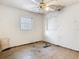 Image of an empty bedroom requiring renovation with a window and ceiling fan at 1263 Dunbar St, Altamonte Springs, FL 32701