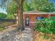 Close-up of the brick house entrance, with lush greenery enhancing the welcoming entryway at 1263 Dunbar St, Altamonte Springs, FL 32701