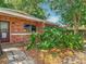 Charming single-story brick home with lush landscaping, perfect for a serene living at 1263 Dunbar St, Altamonte Springs, FL 32701