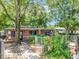 Charming single-story brick home with mature landscaping, gated yard, and inviting entryway at 1263 Dunbar St, Altamonte Springs, FL 32701