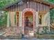 Backyard outbuilding with brick columns, arched doorway, and overgrown vegetation at 1263 Dunbar St, Altamonte Springs, FL 32701